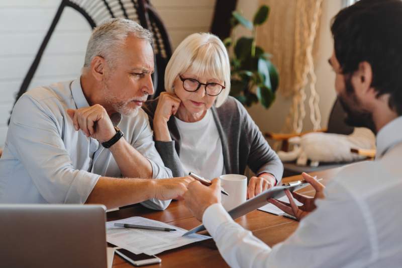 senior-couple-consulting-with-professional-at-wood-2026-03-17-17-39-22-utc